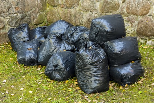 Team clearing garden waste in East London